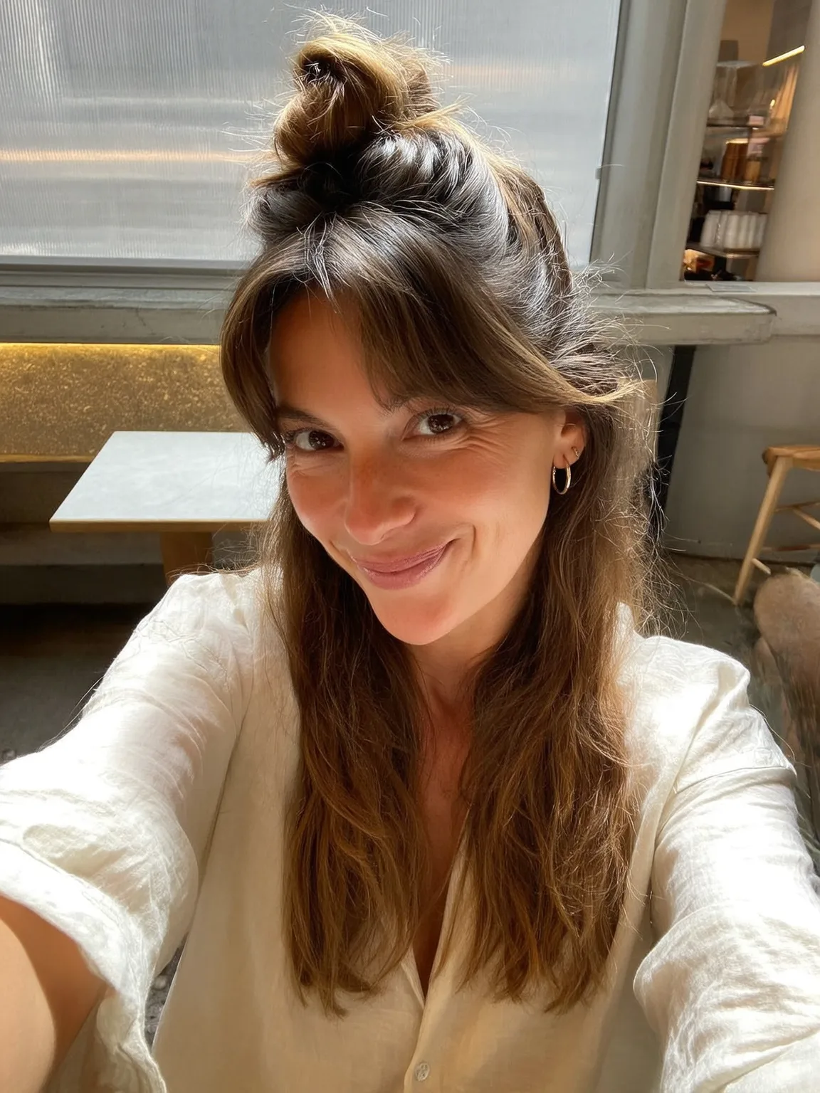 Warm Brown Half-Up Top Knot with Wavy Layers